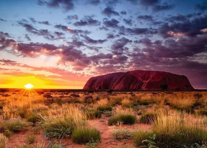 Ravensburger 1000-piece jigsaw puzzle box featuring Sunset over Uluru (Ayers Rock) in the Australian Outback part of the beautiful places collection.