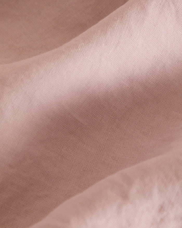 The Foxford Blush Pure Linen Fitted Sheet adds a touch of elegance and comfort to your bed. Crafted from 100% premium linen, it provides exceptional softness, breathability, and durability. The soft blush hue brings warmth and a subtle, sophisticated tone to your bedroom décor. Pre-washed for a relaxed, lived-in feel, it becomes even softer with each use. Naturally temperature-regulating and antibacterial, this fitted sheet is perfect for year-round comfort. Enhance your bedding with this luxurious and time