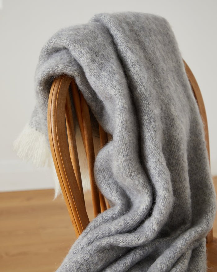 Foxford Croagh Patrick Mohair Throw draped over a chair