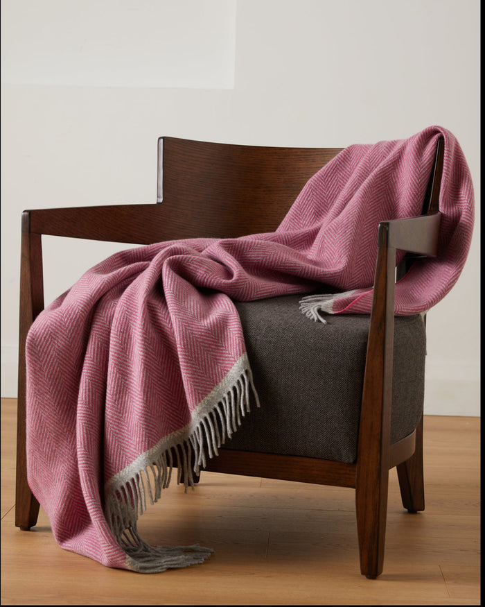 Foxford Croía pink Cashmere and Lambswool Throw on a chair